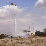 Brush fire burns near Walmart